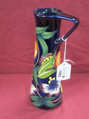 Lot 1285 - A Moorcroft jug in the Passion Fruit pattern,...