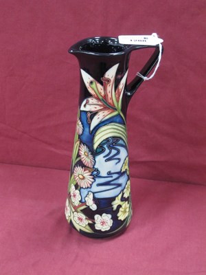 Lot 1288 - A Moorcroft jug decorated with Stargazer and...