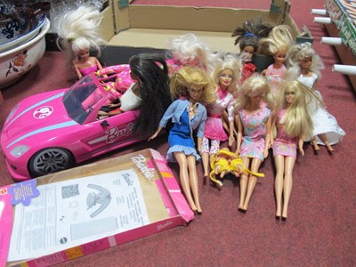 Lot 1013 - A collection of Barbie dolls together with a...