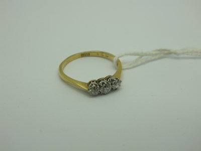 Lot 253 - A Three Stone Diamond Ring, the old brilliant...