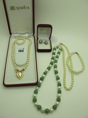 Lot 193 - A Modern Fresh Water Pearl and Polished Green...