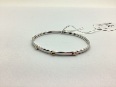 Lot 210 - A Modern 9ct White Gold Bangle, with three...