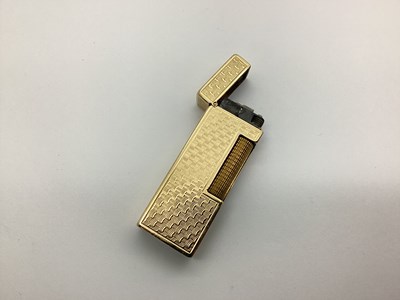 Lot 142 - Dunhill; A 9ct Gold Cigarette Lighter, allover...