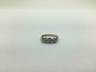 Lot 229 - A Three Stone Diamond Ring, claw set with...