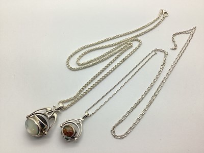 Lot 153 - A Polished Hardstone Inset Swivel Fob Pendant,...