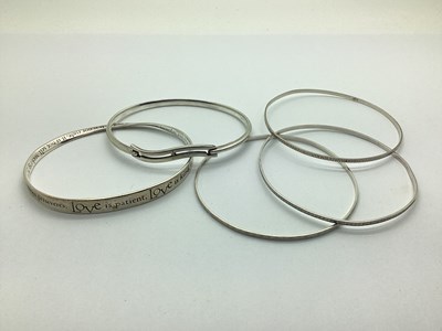 Lot 167 - A Modern Bangle, 'Love is..' with allover...