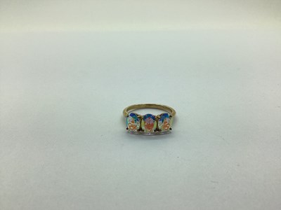 Lot 233 - A 9ct Gold Modern Three Stone Dress Ring, claw...