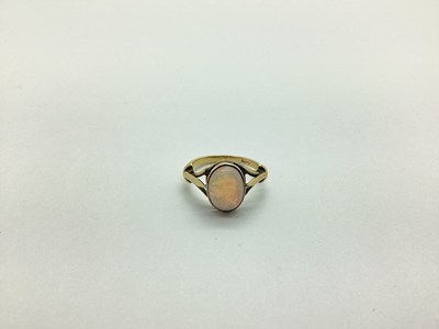 Lot 234 - An Opal Set Dress Ring, cabochon set between...