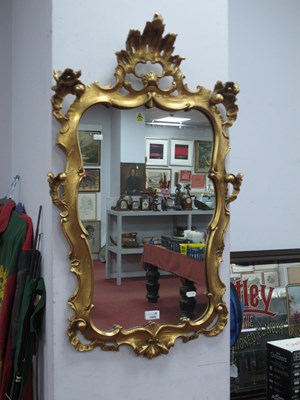 Lot 1459 - An Ornate Roccoco Style Gilt Gesso Wall Mirror,...