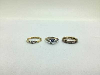 Lot 213 - An Eternity Band, with inset highlights...