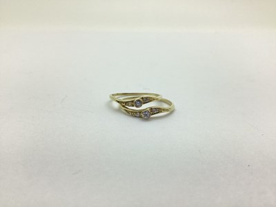 Lot 214 - Two Modern Inset Rings, stacker style, of wave...