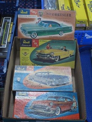 Lot 570 - Four Boxed Revell / AMT plastic model car kits...