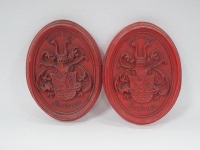 Lot 1252 - Pair of wax oval wall plaques featuring...