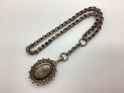 Lot 150 - A Victorian Oval Locket Pendant, textured and...