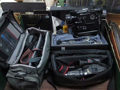 Lot 1020 - Three cased video camcorders to include...