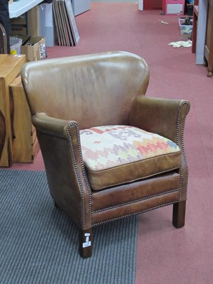 Lot 1520 - Halo Leather Studded Tub Chair, on squat...