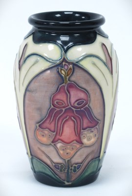 Lot 1284 - A Moorcroft vase decorated in the 'Foxglove'...