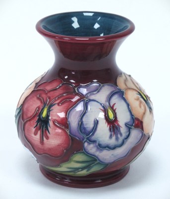 Lot 1292 - A Moorcroft vase decorated in the 'Pansy'...