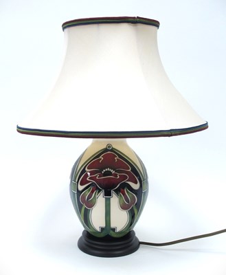 Lot 1154 - A Moorcroft table lamp decorated in the 'Petal...
