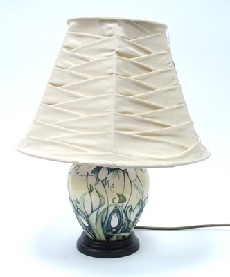Lot 1155 - A Moorcroft table lamp decorated in the...