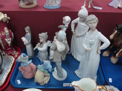 Lot 1208 - Lladro and Nao figurines to include girl with...