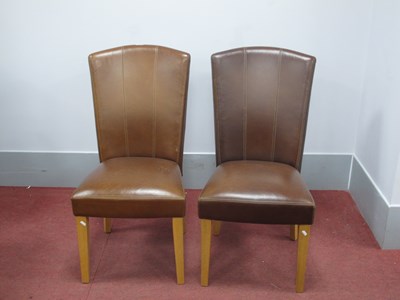 Lot 1569 - A Pair of Brown Leather Chairs, on oak legs.