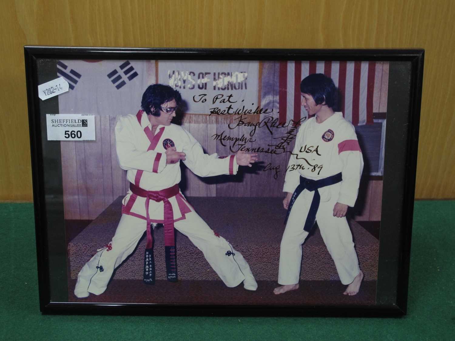 Lot 560 - Photograph of Elvis Presley, with karate...