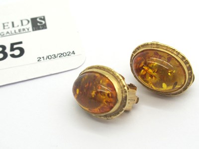 Lot 85 - A Pair of Modern 9ct Gold Amber Clip On...