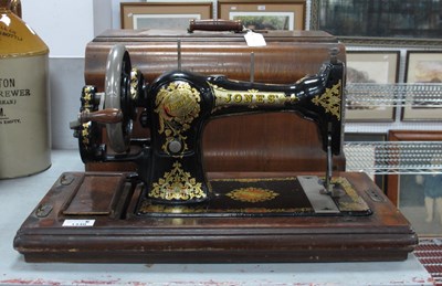 Lot 1440 - Early XX Century Jones sewing machine in a...