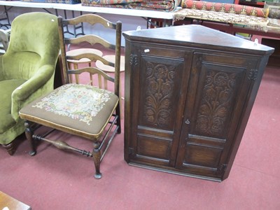 Lot 1532 - Oak corner wall cupboard with carved upper...