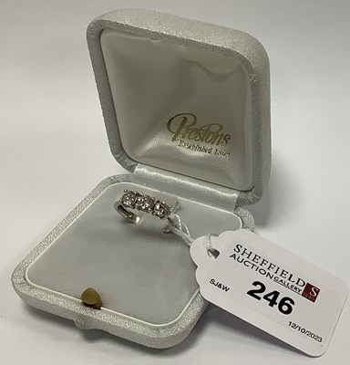 Lot 233 - A Three Stone Diamond Ring, the brilliant cut...