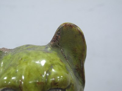 Lot 1082 - A Jones, Bridgend Pottery Green Glazed Model...