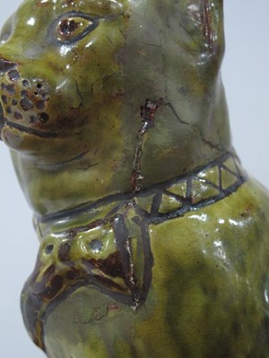Lot 1082 - A Jones, Bridgend Pottery Green Glazed Model...