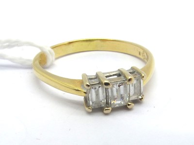 Lot 169 - A Modern 18ct Gold Millennium Cut Three Stone...