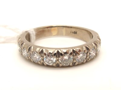 Lot 211 - A Diamond Set Half Eternity Band Ring, uniform...