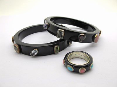 Lot 162 - A Pair of Modern Multi Gem Set Black Bangles,...