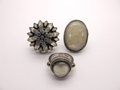 Lot 222 - A Large Moonstone Oval Panel Ring, collet set,...