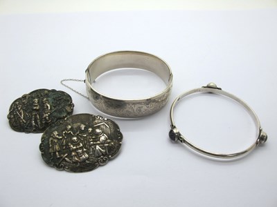 Lot 187 - A Hallmarked Silver hinged Bangle, leaf scroll...