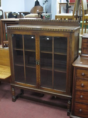 Lot 1548 - 1930s oak display cabinet with circle carving...