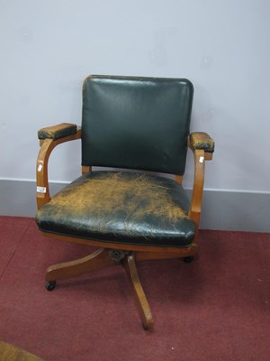 Lot 1573 - Oak swivel office chair circa 1930s with worn...