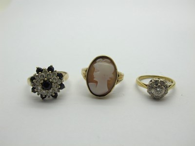 Lot 216 - A Dainty Diamond Set Cluster Ring, stamped...