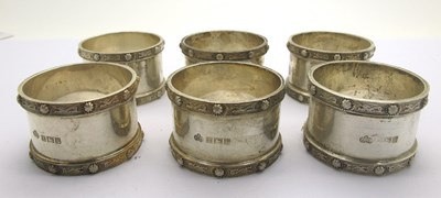 Lot 101 - A Set of Six Hallmarked Silver Napkin Rings,...