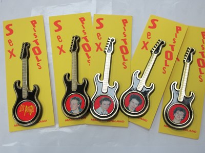 Lot 1296 - Sex Pistols Guitar Brooches, featuring four...