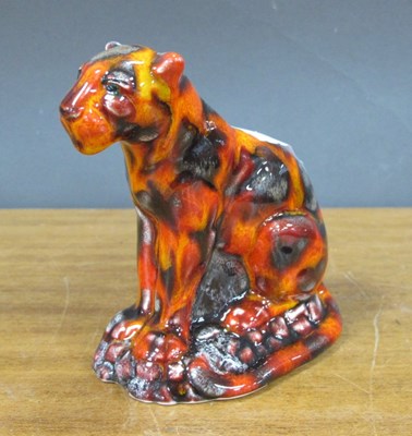 Lot 1261 - Anita Harris 'Leopard Figure' in fusion glazes,...