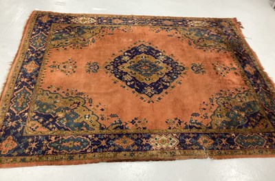 Lot 1487 - XX Century Wool Carpet, with an orange ground,...