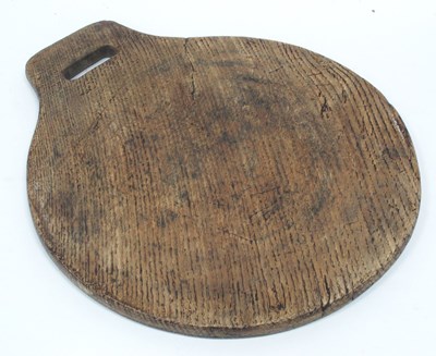 Lot 1303 - A Large Oak Circular Chopping Board, with...