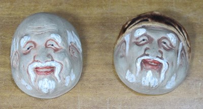 Lot 1289 - A Pair of Small Oriental Painted Masks, 5cm high.