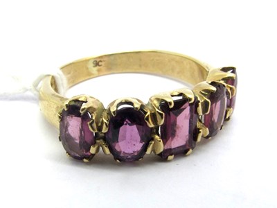 Lot 156 - An Almandine Garnet Five Stone Dress Ring,...