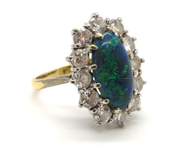 Lot 152 - A Large Black Opal and Diamond Oval Cluster...