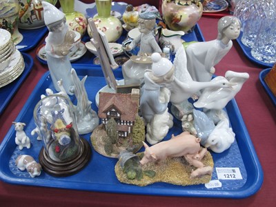 Lot 1212 - Lladro Figures, of a child artist, swans,...